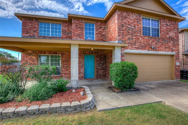 view of front of house featuring a porch and a garage