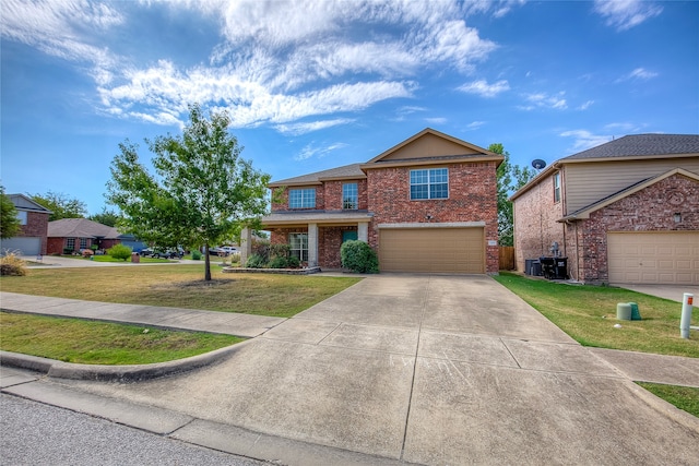 view of front of house featuring a front lawn and a garage