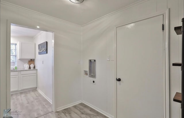 washroom with washer hookup, hookup for an electric dryer, light hardwood / wood-style flooring, and crown molding