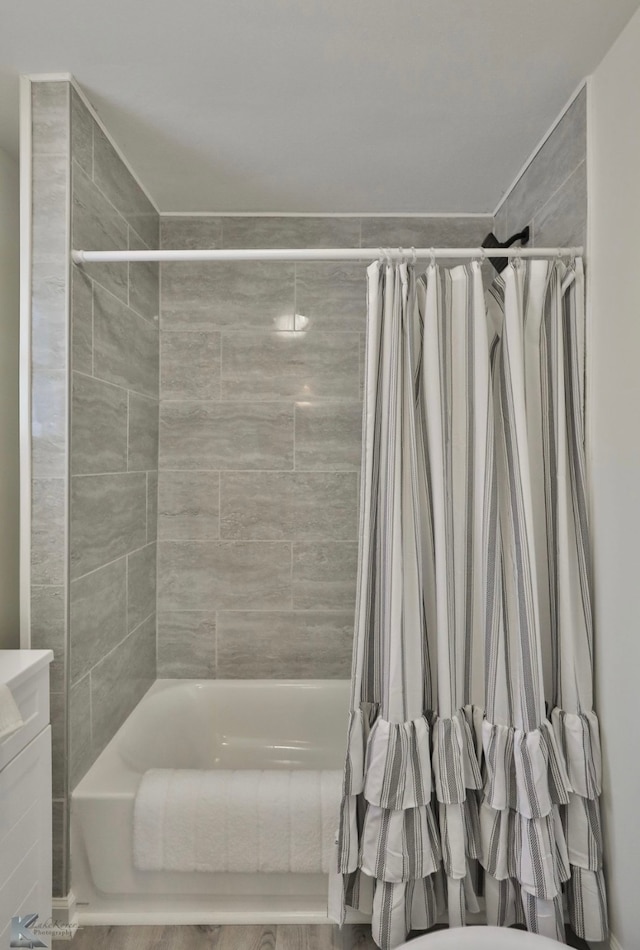 bathroom featuring vanity and shower / tub combo