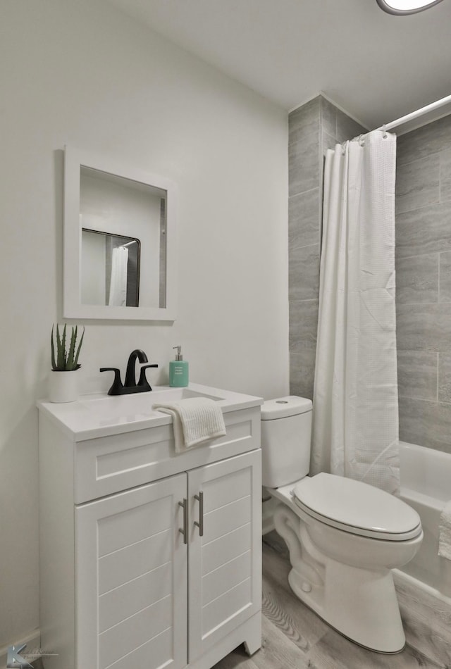 full bathroom with wood-type flooring, vanity, toilet, and shower / tub combo with curtain