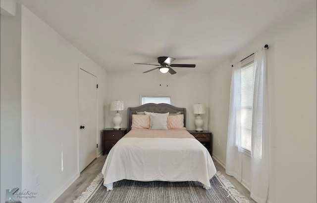 bedroom featuring ceiling fan and hardwood / wood-style flooring