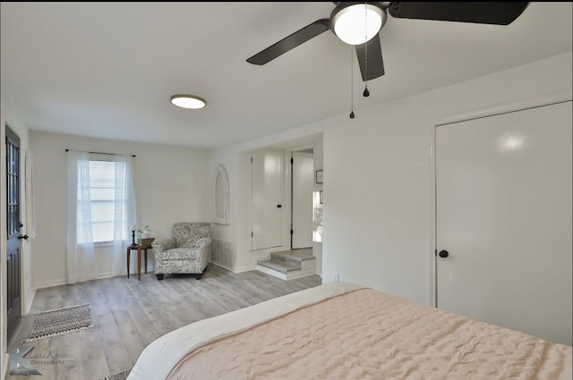 bedroom with ceiling fan and light hardwood / wood-style flooring