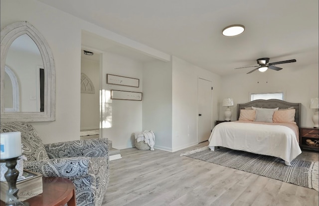 bedroom with light hardwood / wood-style floors and ceiling fan