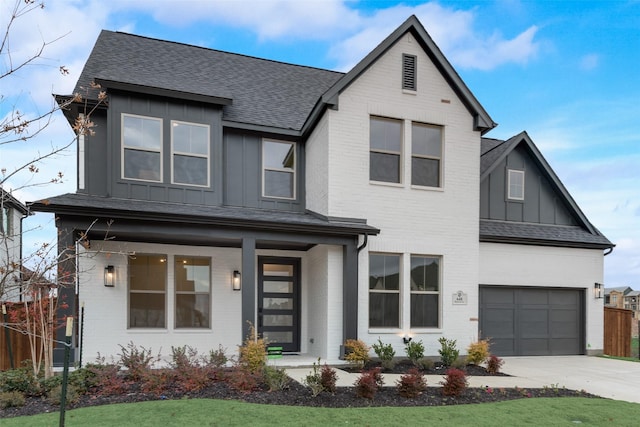 view of front of house with a garage and a porch