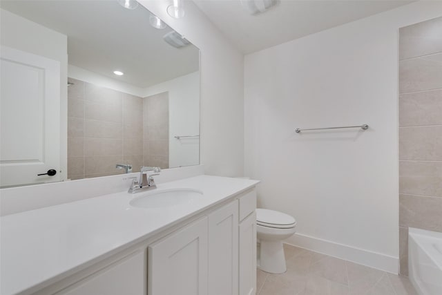 bathroom featuring tile patterned flooring, vanity, and toilet