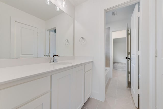 bathroom with tile patterned flooring and vanity