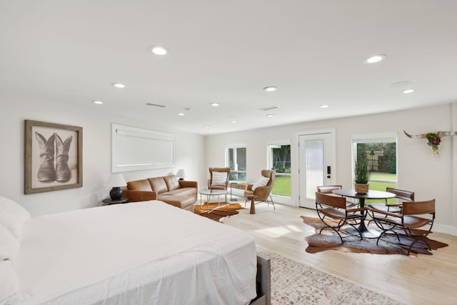 bedroom with light hardwood / wood-style flooring