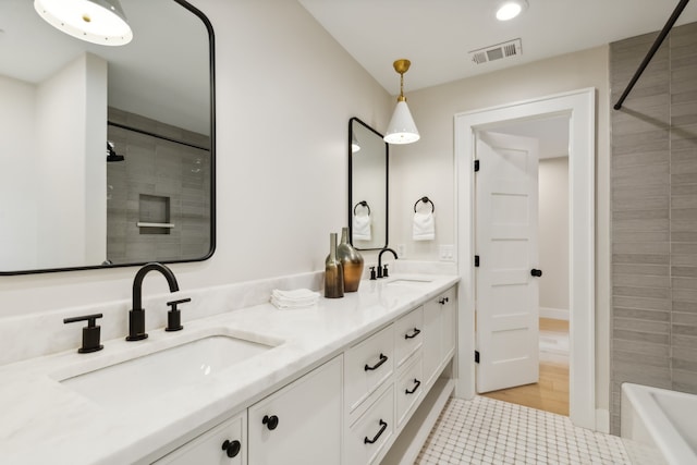 bathroom featuring tile patterned flooring and vanity