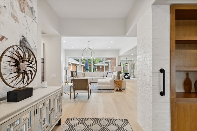 interior space featuring light wood-type flooring and a wood stove