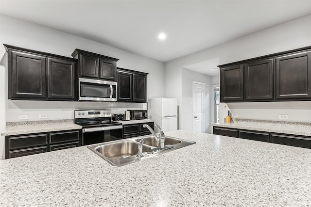 kitchen featuring appliances with stainless steel finishes and sink