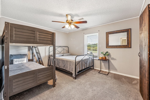 1424 Prairie Wind Blvd, Stephenville, TX 76401 - bedroom featuring carpet, a textured ceiling, ornamental molding, baseboards, and a ceiling fan