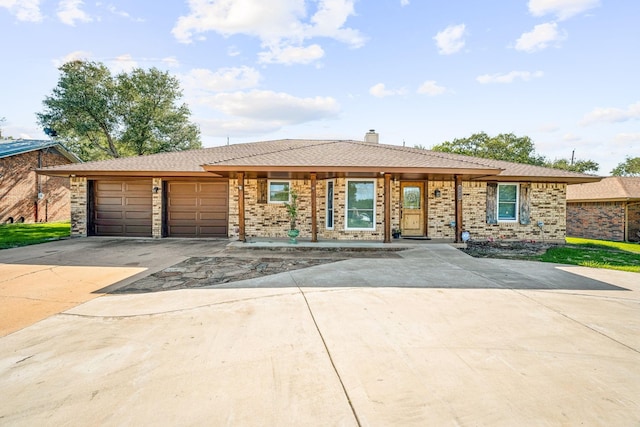 1424 Prairie Wind Blvd, Stephenville, TX 76401 - ranch-style house featuring driveway, an attached garage, brick siding, and a chimney