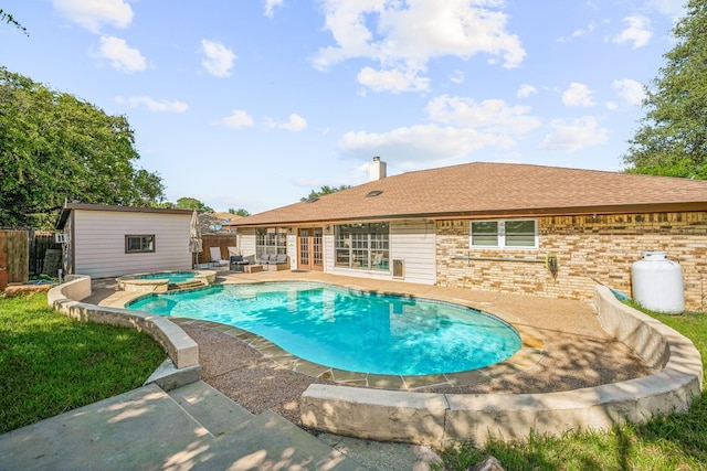 1424 Prairie Wind Blvd, Stephenville, TX 76401 - view of swimming pool with a patio area, an outbuilding, french doors, and a pool with connected hot tub