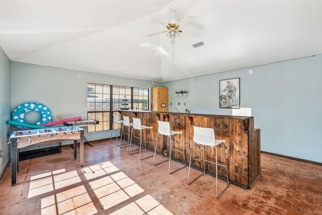 bar with lofted ceiling and ceiling fan