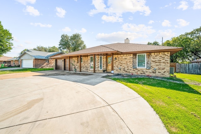 ranch-style house with a front yard and a garage