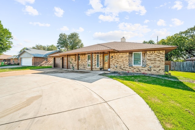 1424 Prairie Wind Blvd, Stephenville, TX 76401 - view of front of property with brick siding, driveway, a garage, and a chimney