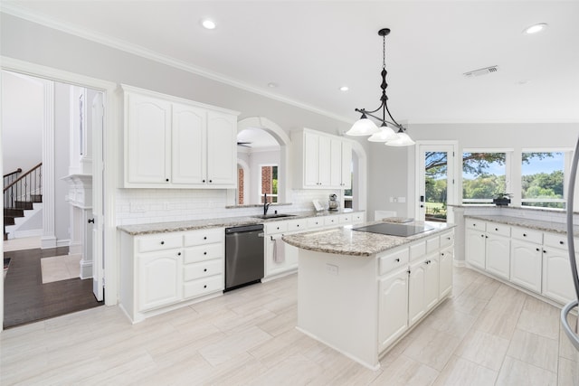 kitchen featuring a wealth of natural light, white cabinetry, and black appliances