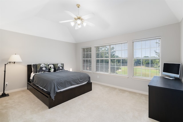 bedroom featuring lofted ceiling, light carpet, and ceiling fan