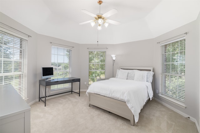 bedroom featuring light carpet and ceiling fan