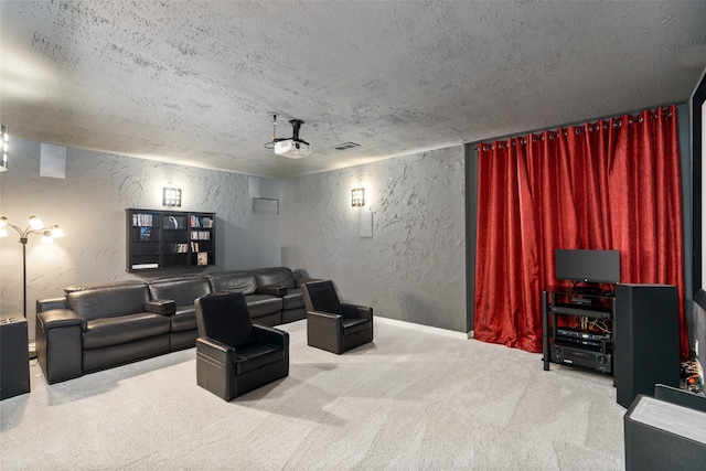 carpeted home theater featuring a textured ceiling