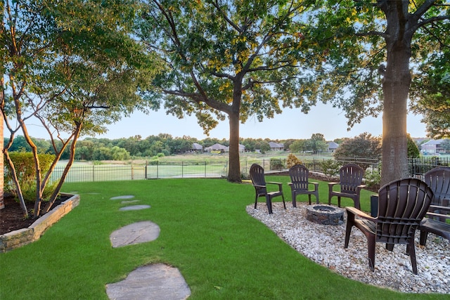 view of yard featuring an outdoor fire pit