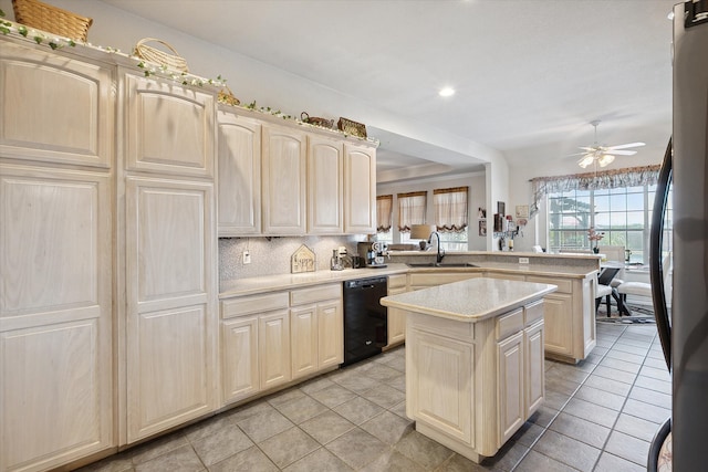 kitchen with a kitchen island, ceiling fan, sink, kitchen peninsula, and dishwasher