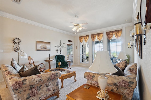 carpeted living room with crown molding and ceiling fan