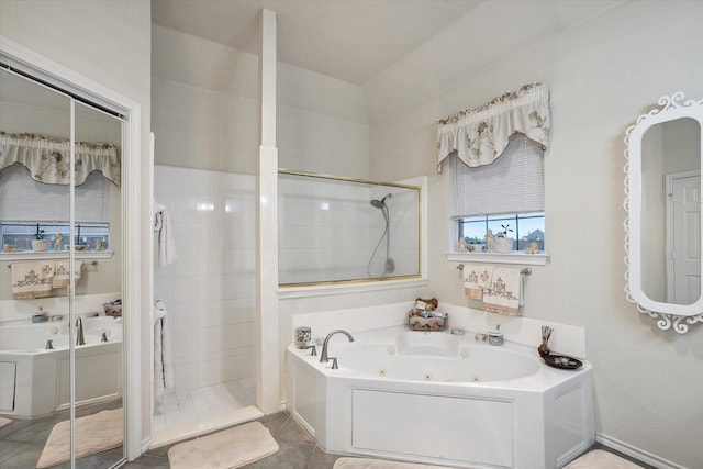 bathroom featuring tile patterned flooring and plus walk in shower