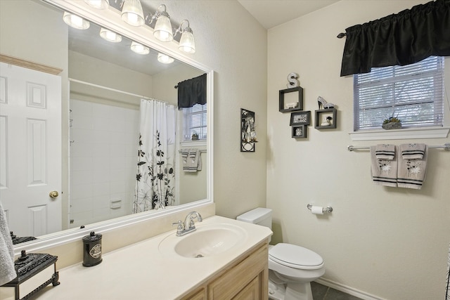 bathroom with a shower with curtain, tile patterned floors, vanity, and toilet