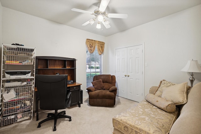 office featuring ceiling fan and light carpet