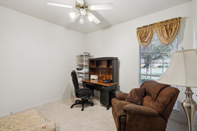 office space featuring ceiling fan and light colored carpet