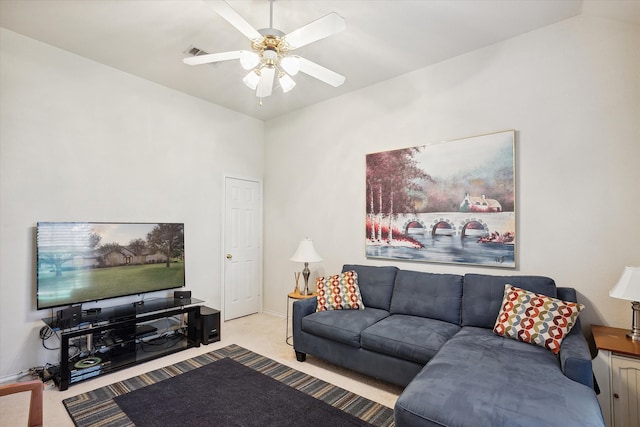 carpeted living room featuring lofted ceiling and ceiling fan