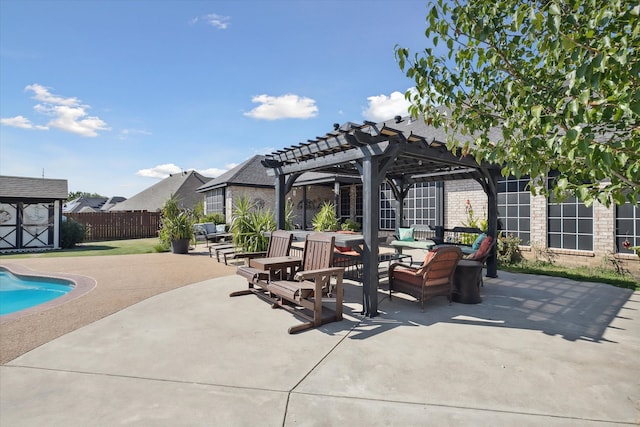 view of patio / terrace with a fenced in pool, a storage unit, and a pergola