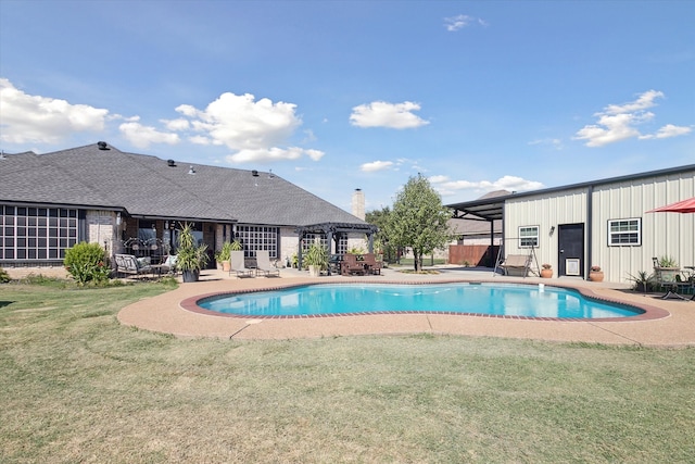 view of swimming pool featuring a yard and a patio area