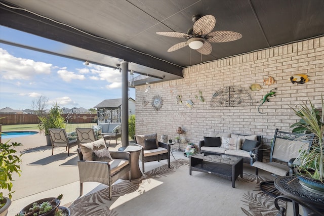 view of patio with an outdoor hangout area, ceiling fan, and a fenced in pool