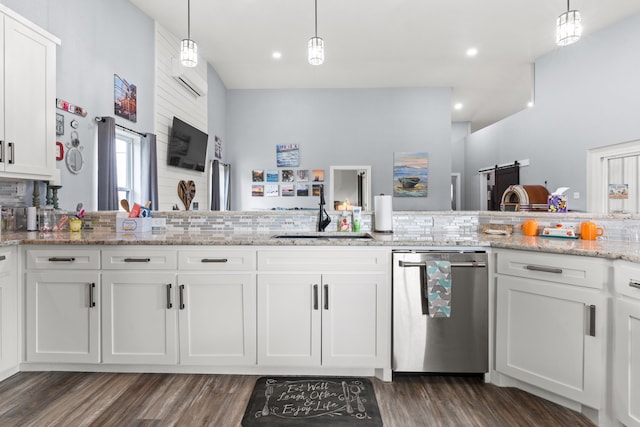 kitchen with white cabinetry, dishwasher, sink, and decorative light fixtures