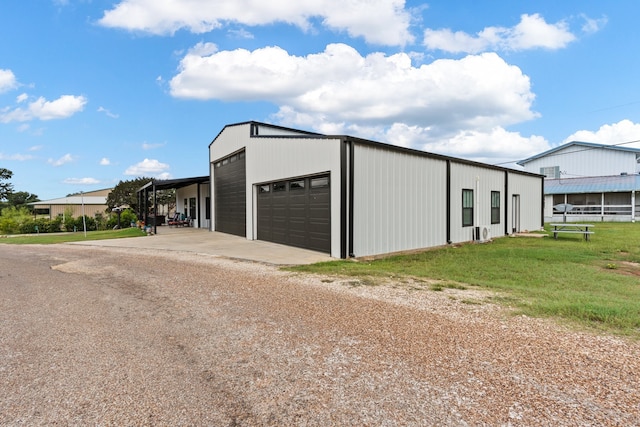 garage featuring a lawn