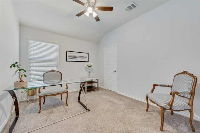 carpeted office featuring vaulted ceiling and ceiling fan