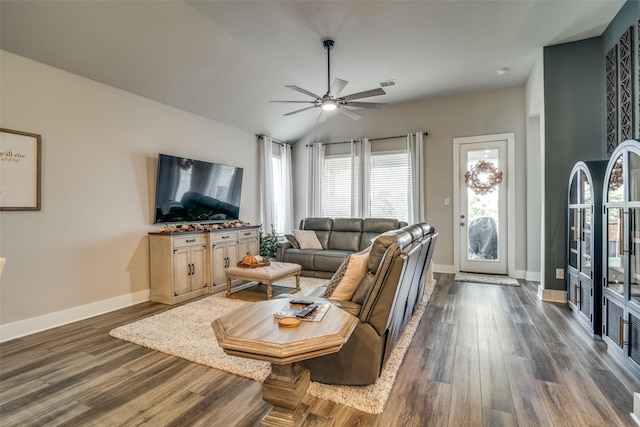 living room featuring ceiling fan, dark hardwood / wood-style flooring, and lofted ceiling