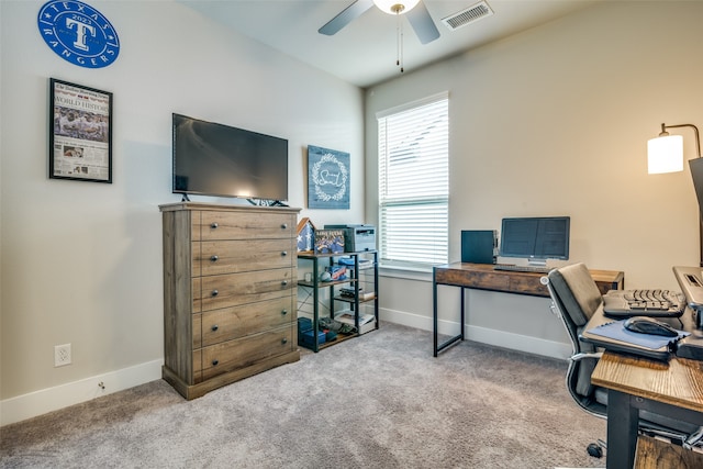 carpeted office with ceiling fan