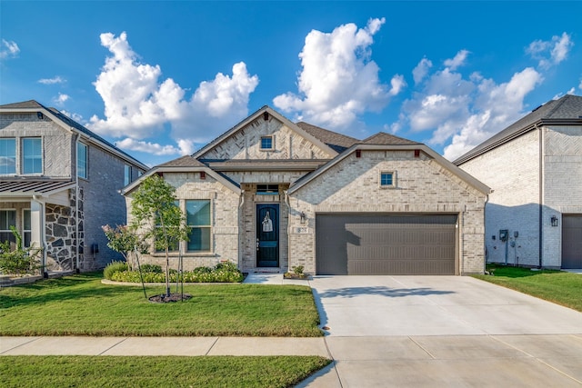 view of front facade featuring a front yard and a garage