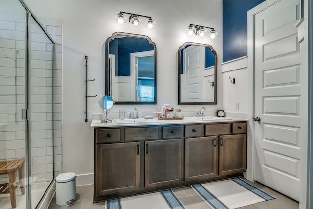 bathroom with tile patterned floors, an enclosed shower, and vanity