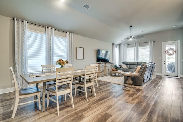 dining room with ceiling fan and wood-type flooring