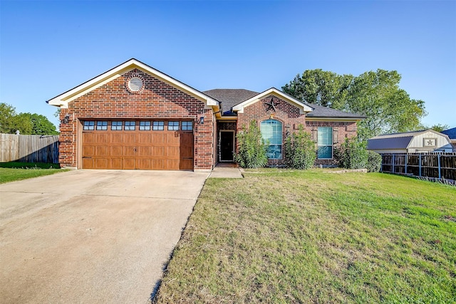 ranch-style house featuring a front yard and a garage