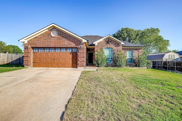 single story home featuring fence, a garage, a front lawn, and brick siding