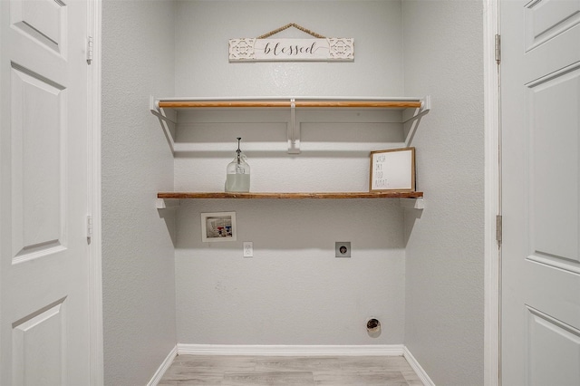 laundry room featuring laundry area, baseboards, hookup for an electric dryer, light wood-style flooring, and washer hookup