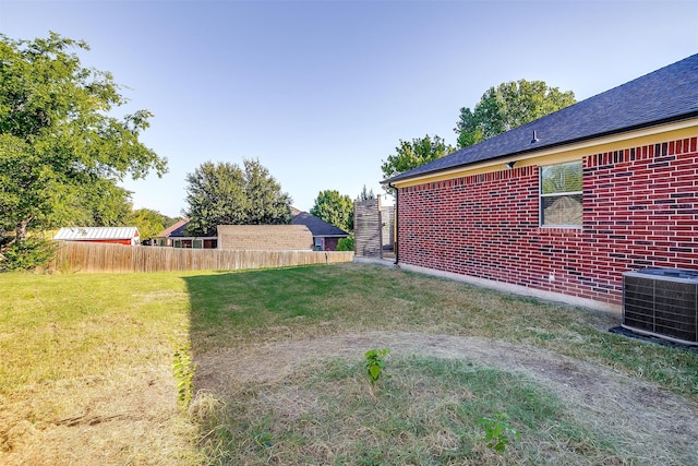 view of yard featuring central AC