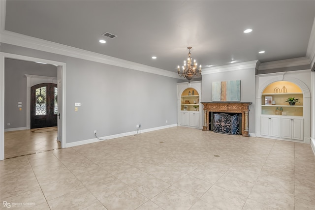 unfurnished living room with built in shelves, crown molding, and an inviting chandelier