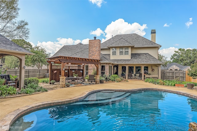 view of swimming pool with a patio and a pergola